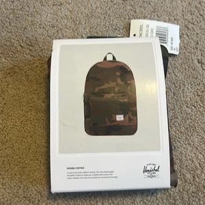 New in package Herschel packable daypack in camouflage.